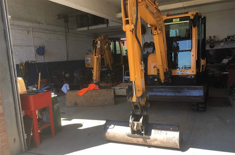 Interior of the Kss workshop showing two of our diggers