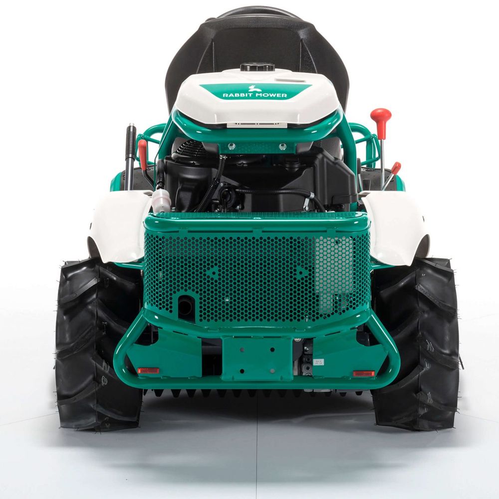 Rear view of Orec Rabbit ride-on brushcutter with large treaded tyres and green frame